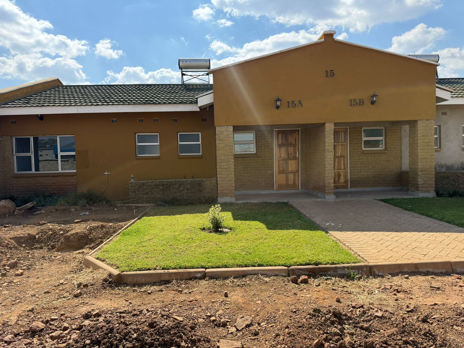 Completed housing with landscaping